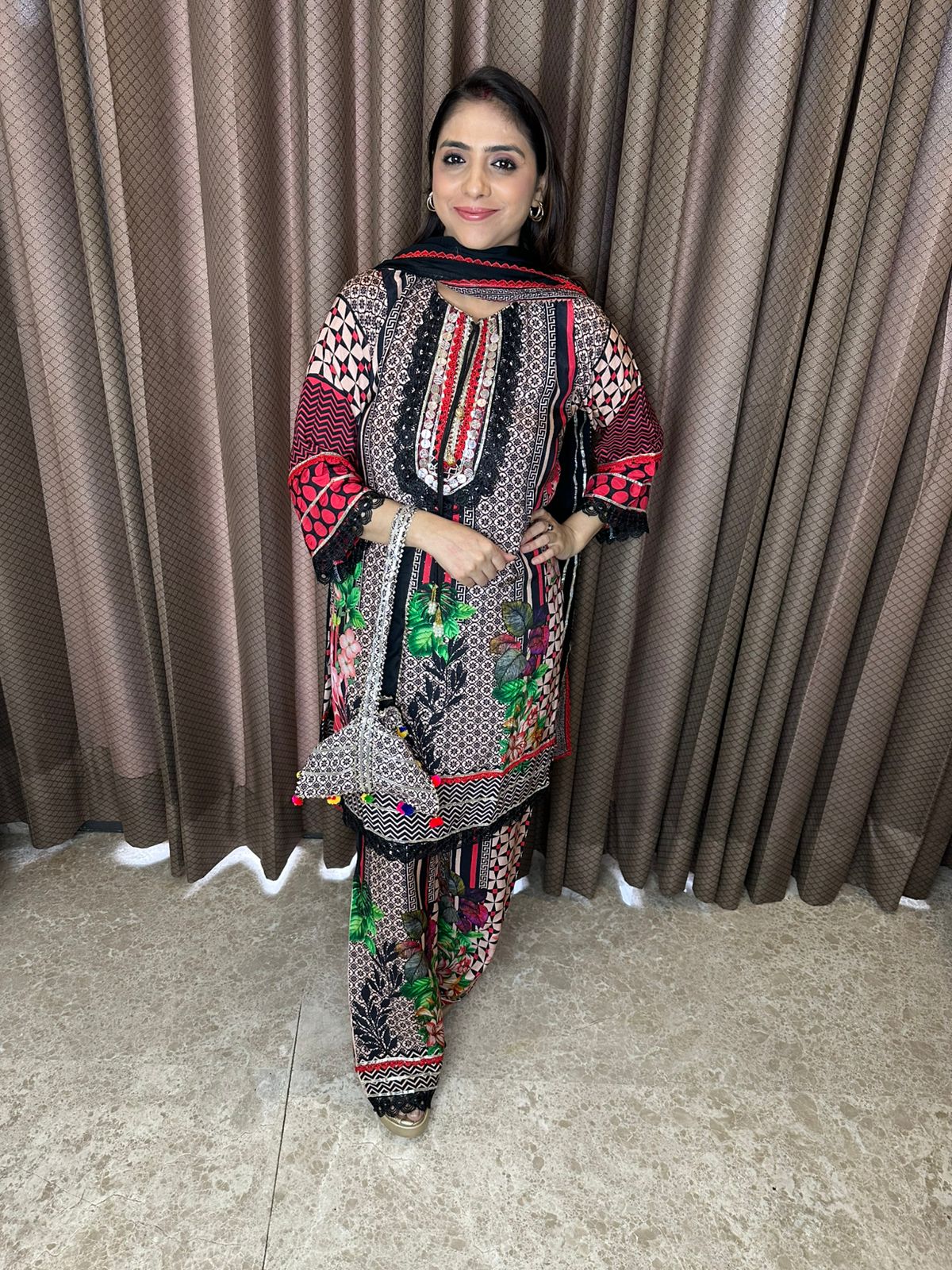 Multicolor Printed Suit Set with Embroidered Neckline & Dupatta with Potli