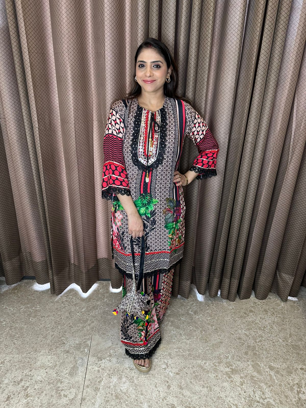 Multicolor Printed Suit Set with Embroidered Neckline & Dupatta with Potli