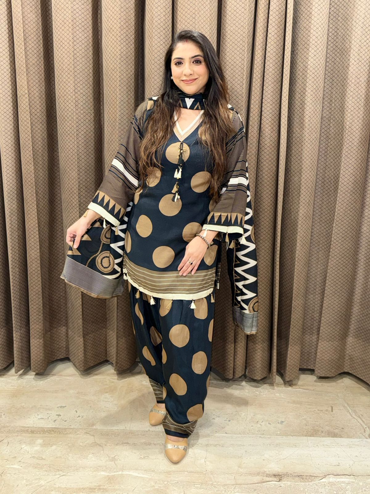 Elegant black and brown polka farsi set with dupatta and tassel detailing