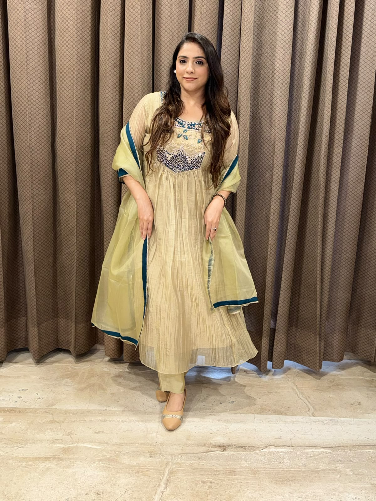 Exclusive Golden Anarkali set with handwork detailing