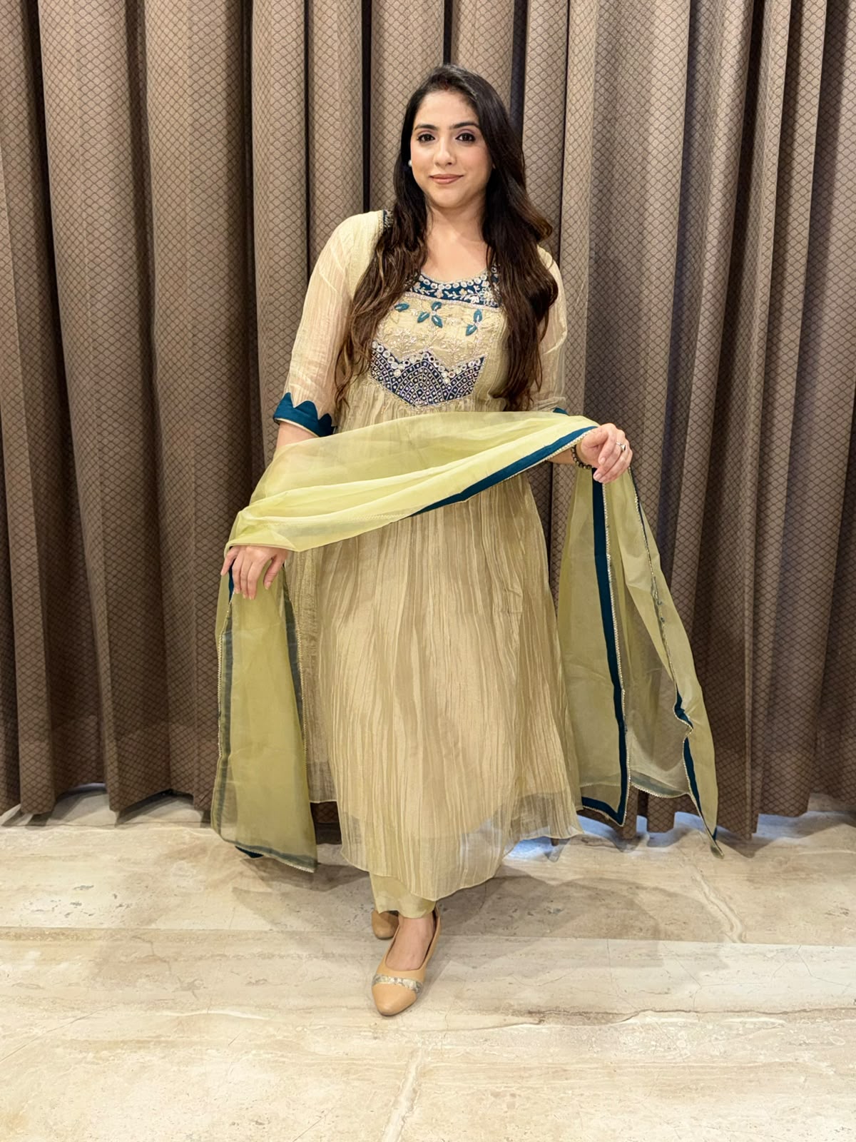 Exclusive Golden Anarkali set with handwork detailing