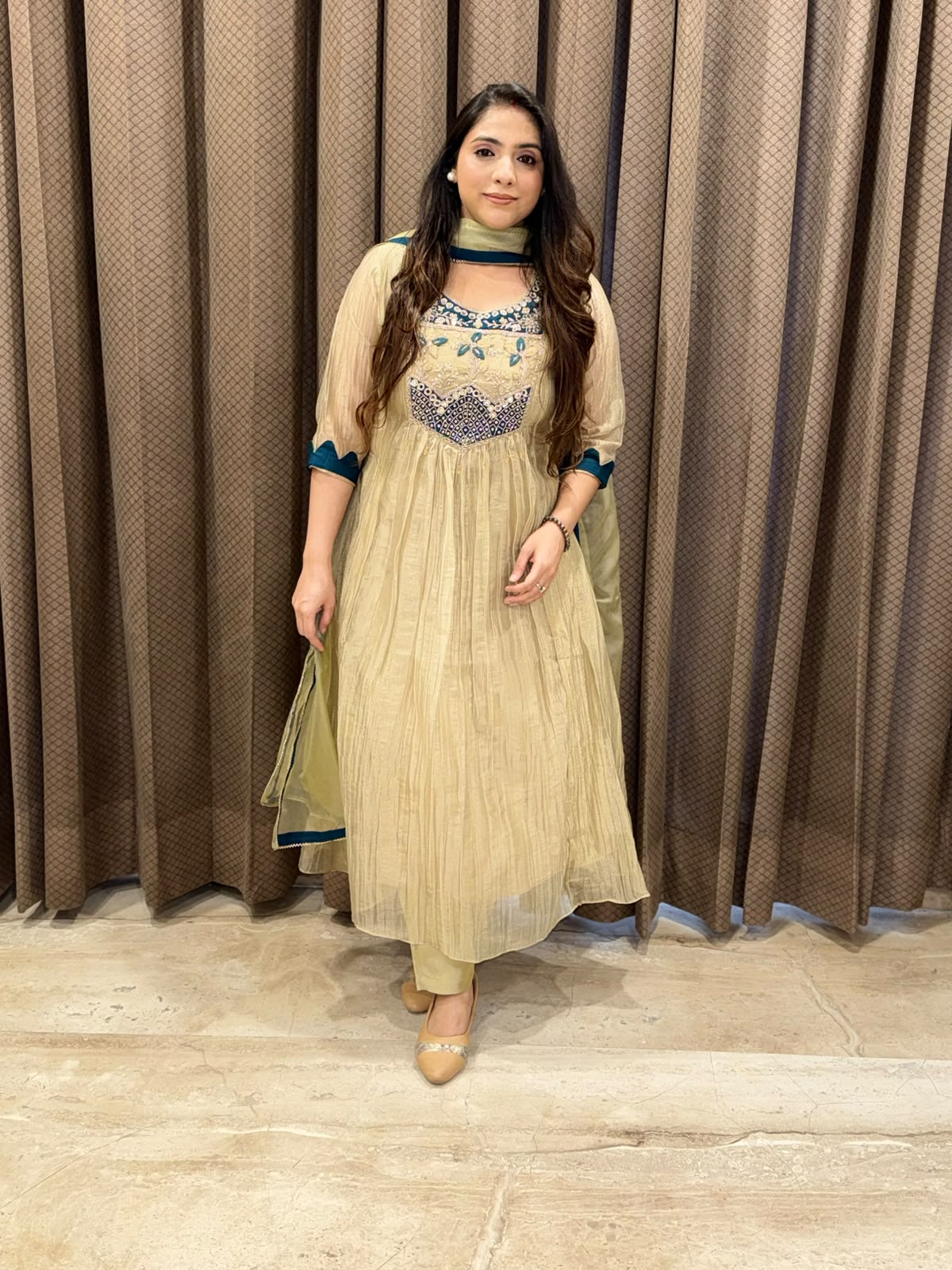 Exclusive Golden Anarkali set with handwork detailing