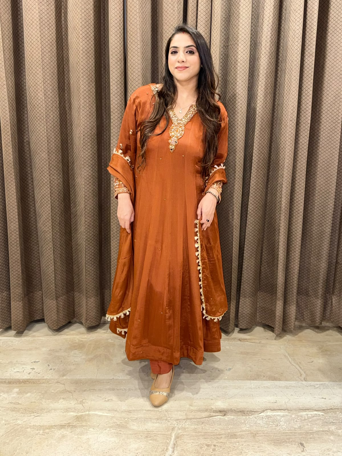 Rust designer Anarkali set with heavy handwork and dupatta