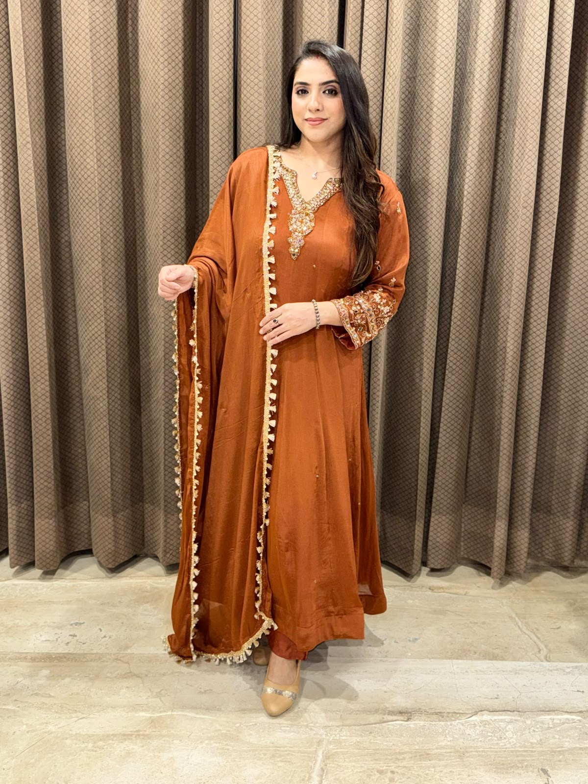 Rust designer Anarkali set with heavy handwork and dupatta