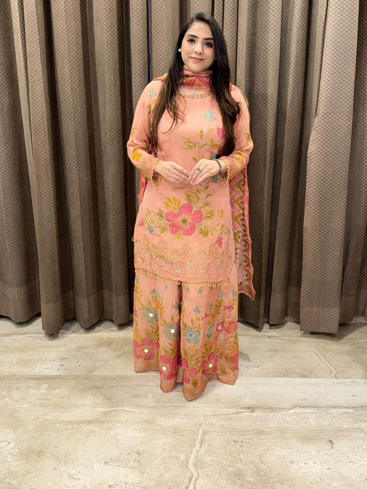 Peach floral sharara set with dupatta and mirror handwork