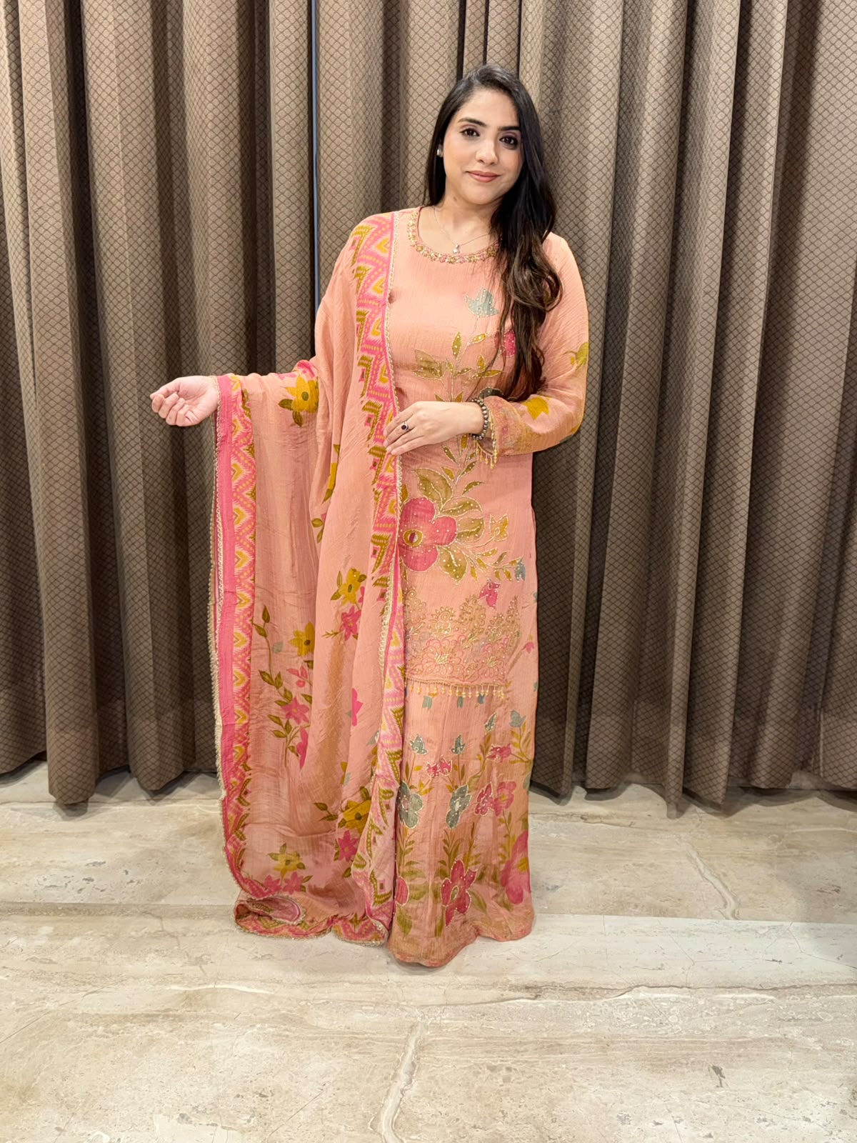 Peach floral sharara set with dupatta and mirror handwork