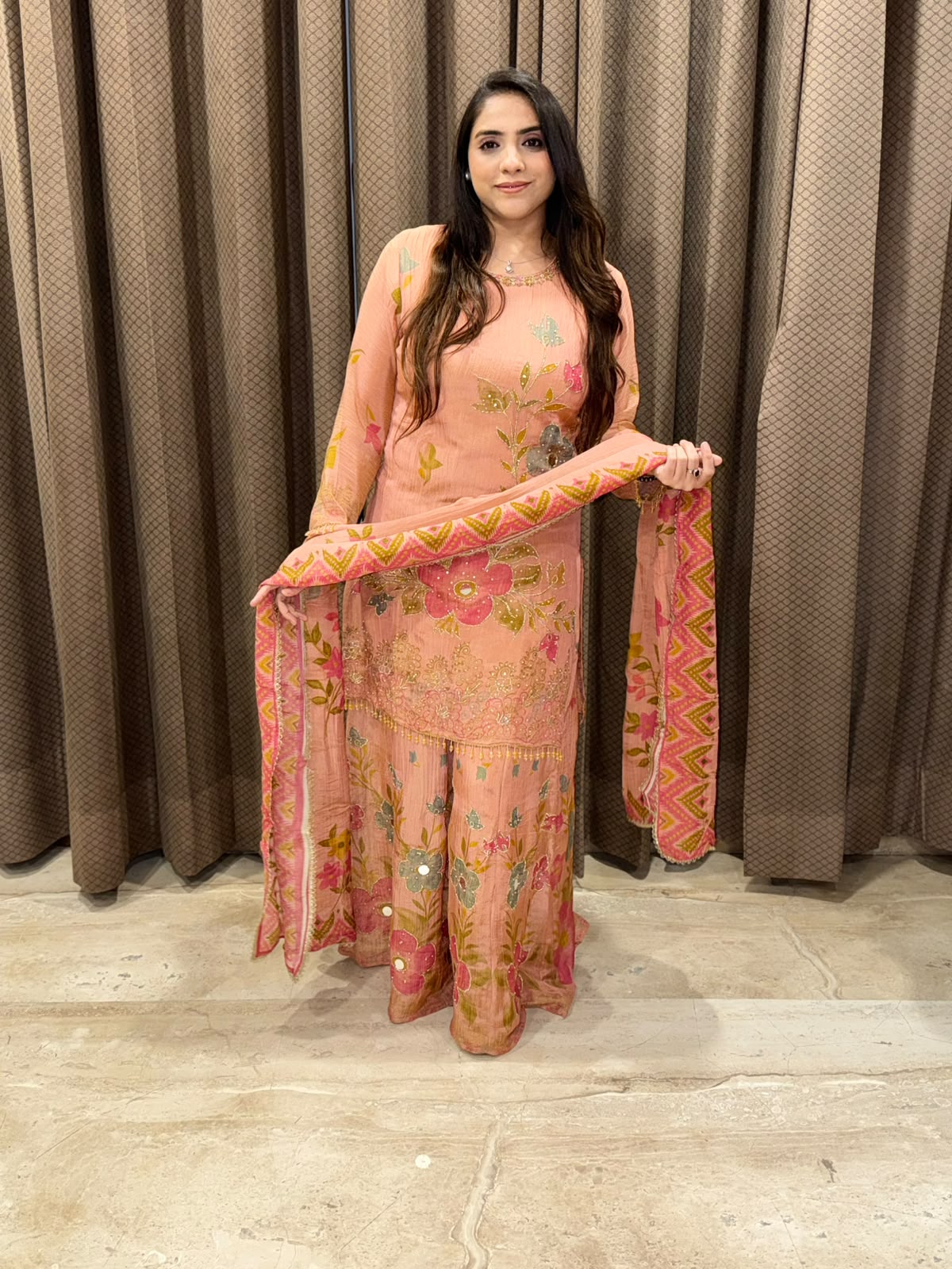Peach floral sharara set with dupatta and mirror handwork