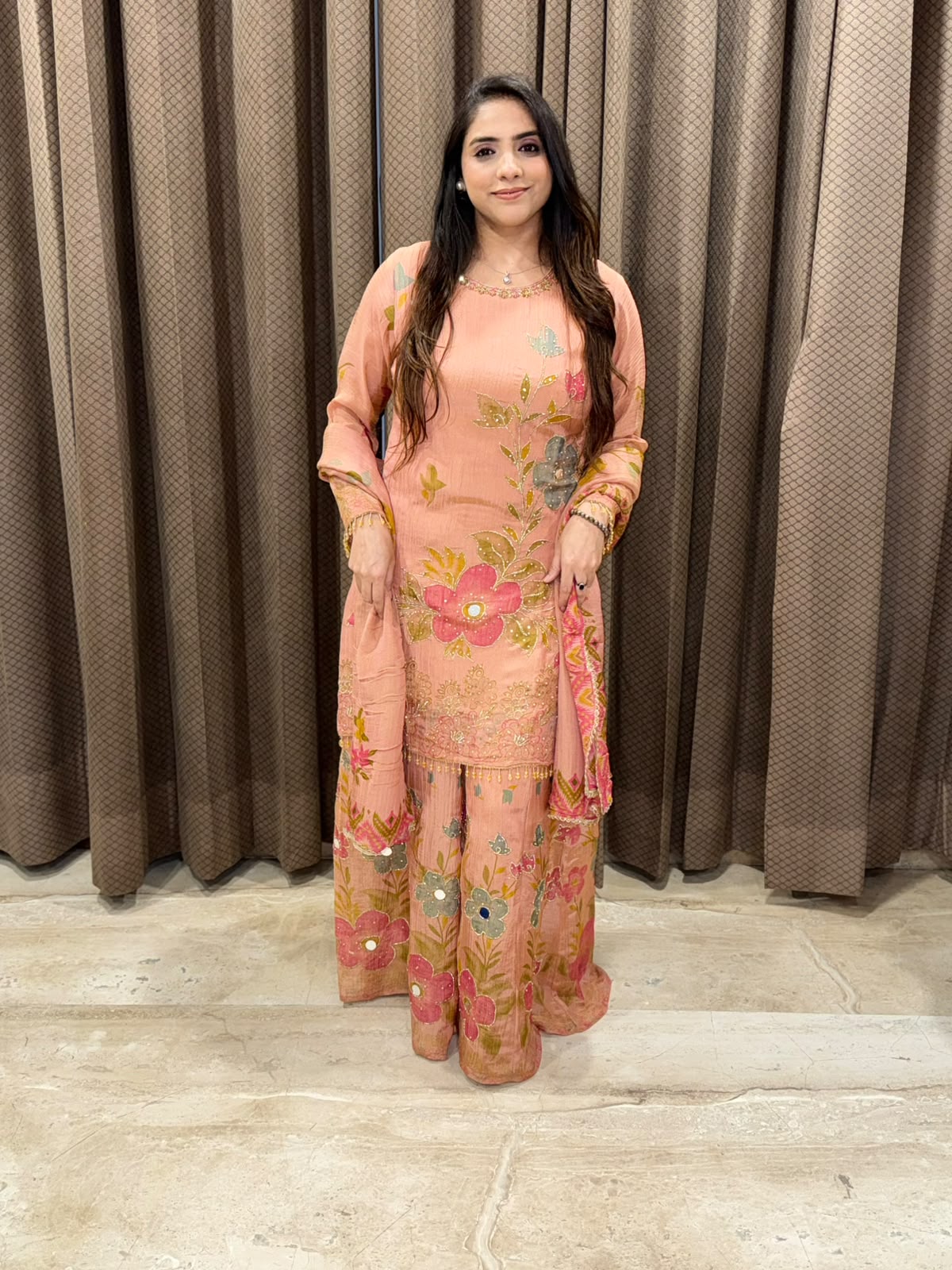 Peach floral sharara set with dupatta and mirror handwork