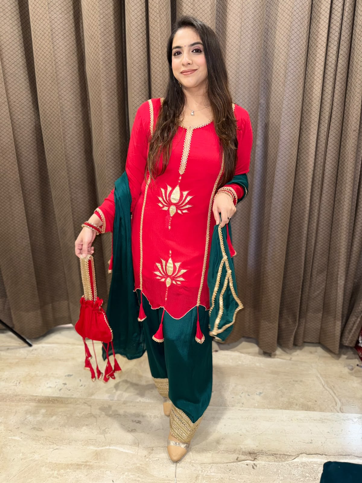 Exclusive Red and Green farshi set with tassels,lotus work & potli