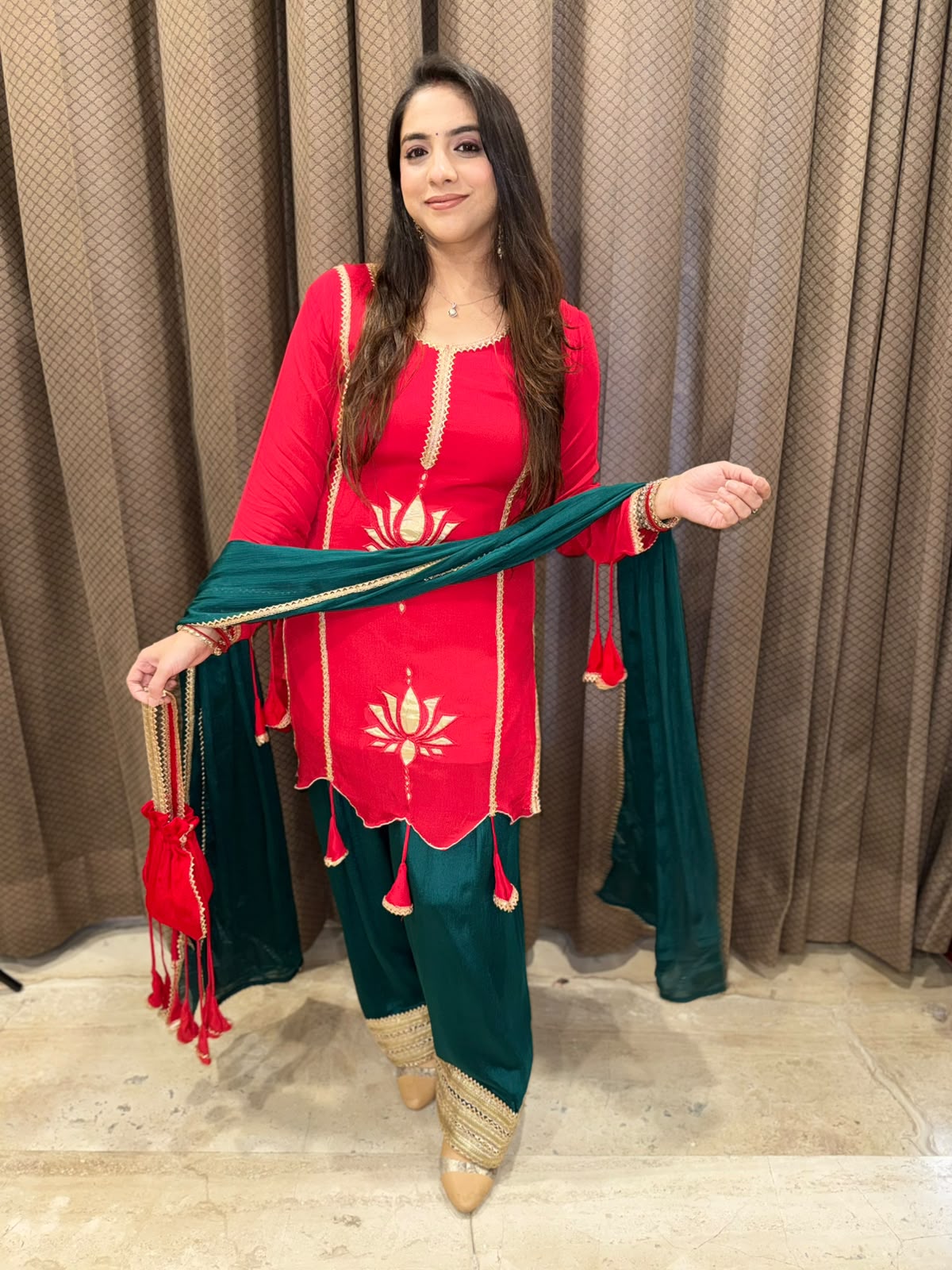 Exclusive Red and Green farshi set with tassels,lotus work & potli