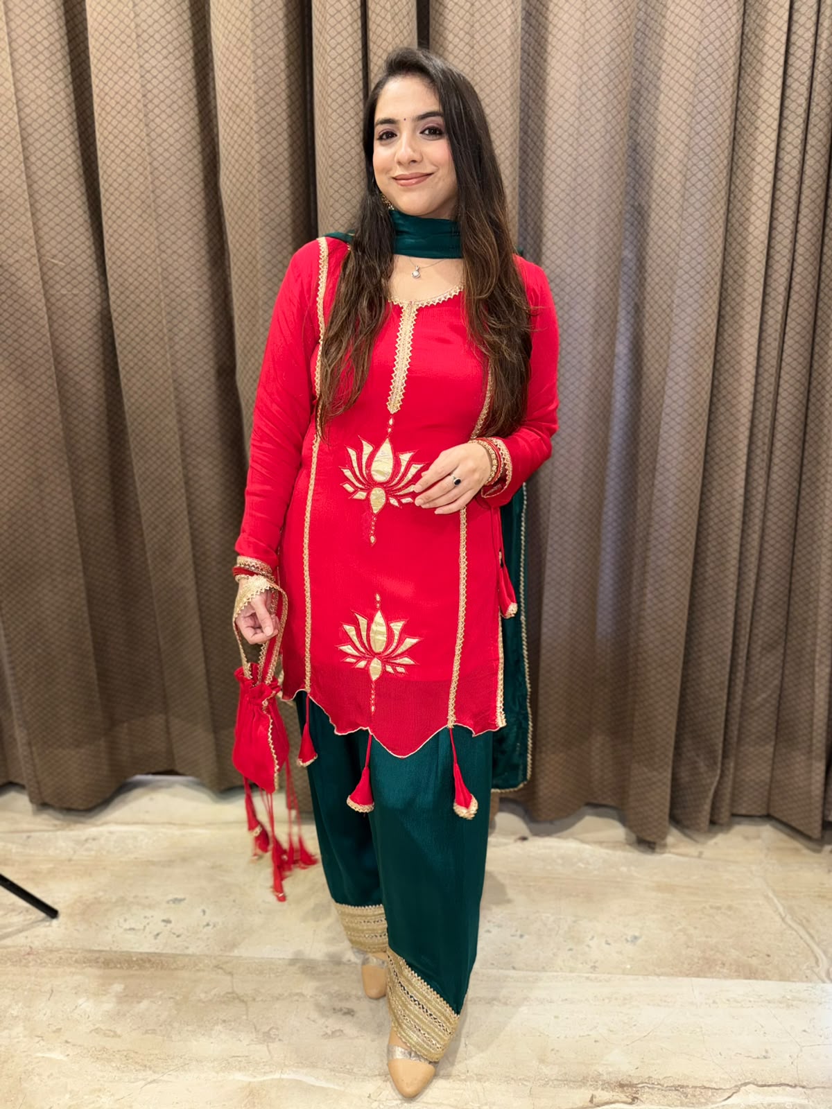 Exclusive Red and Green farshi set with tassels,lotus work & potli