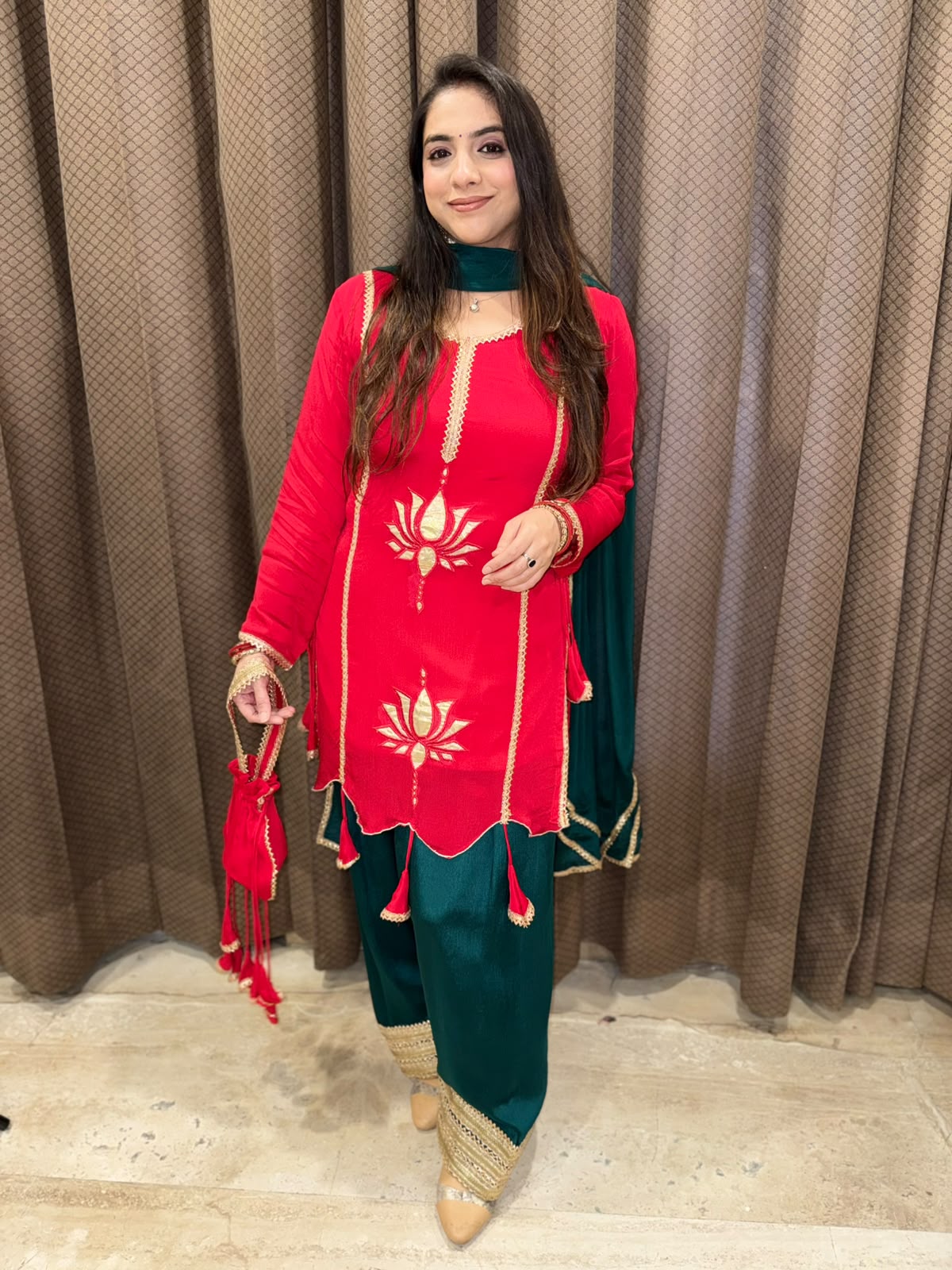 Exclusive Red and Green farshi set with tassels,lotus work & potli