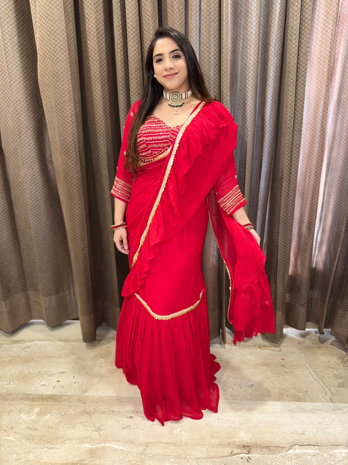 Gorgeous Red Drape Saree with Handwork Blouse & latkan